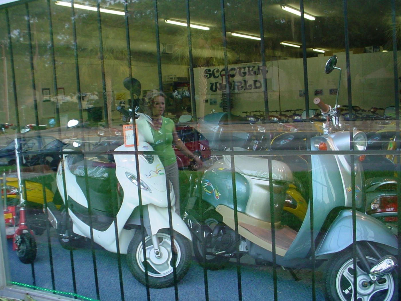 Scooter World showroom window with Geely mopeds